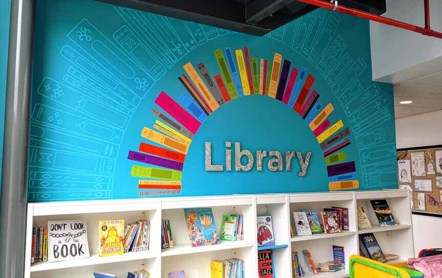 An image of book wall graphics in a library.